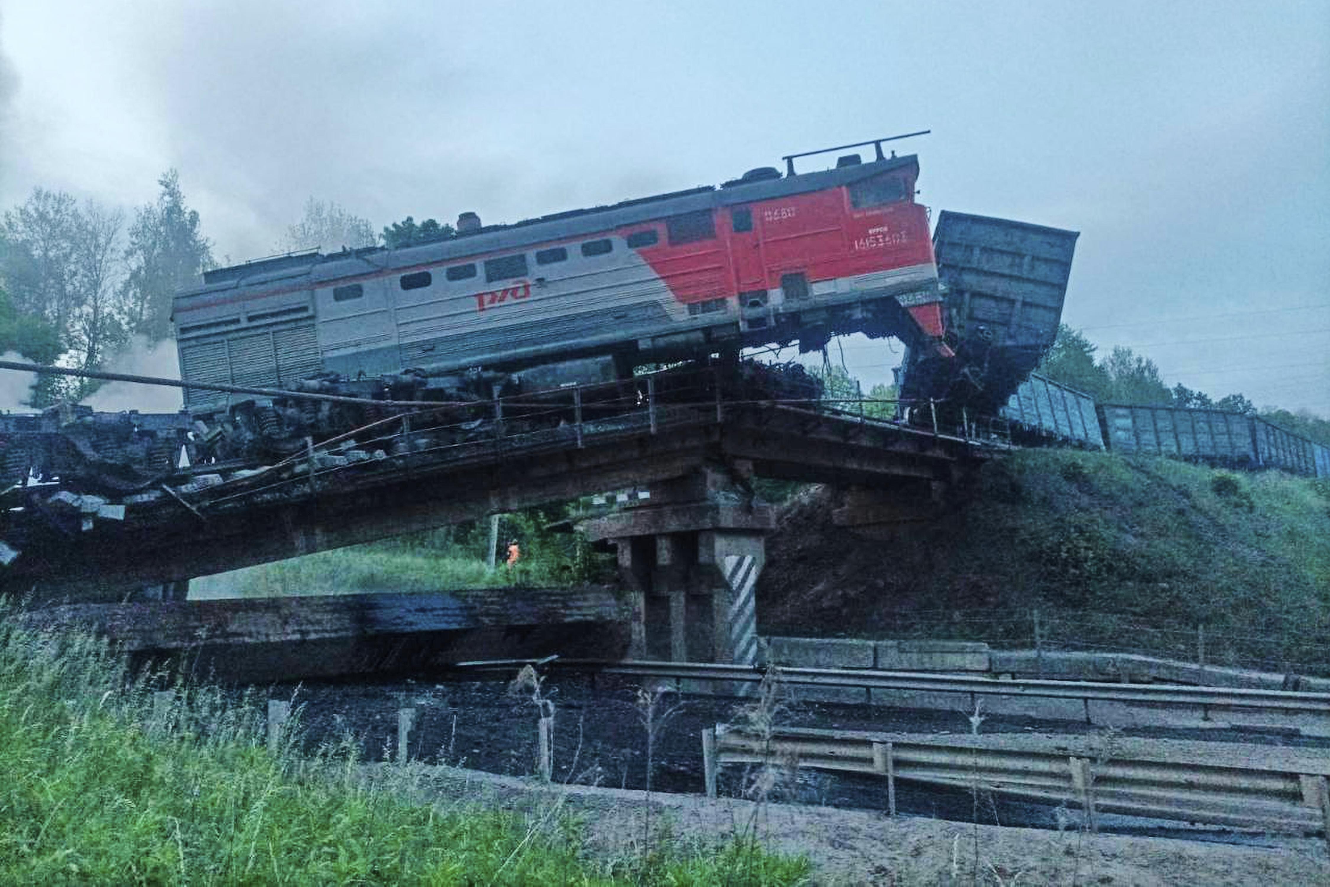 This photo released by Acting Governor of the Kursk Region Alexander Khinshtein telegram channel on Sunday, June 1, 2025, shows a view of a damaged bridge after the crash of a freight train in Russia