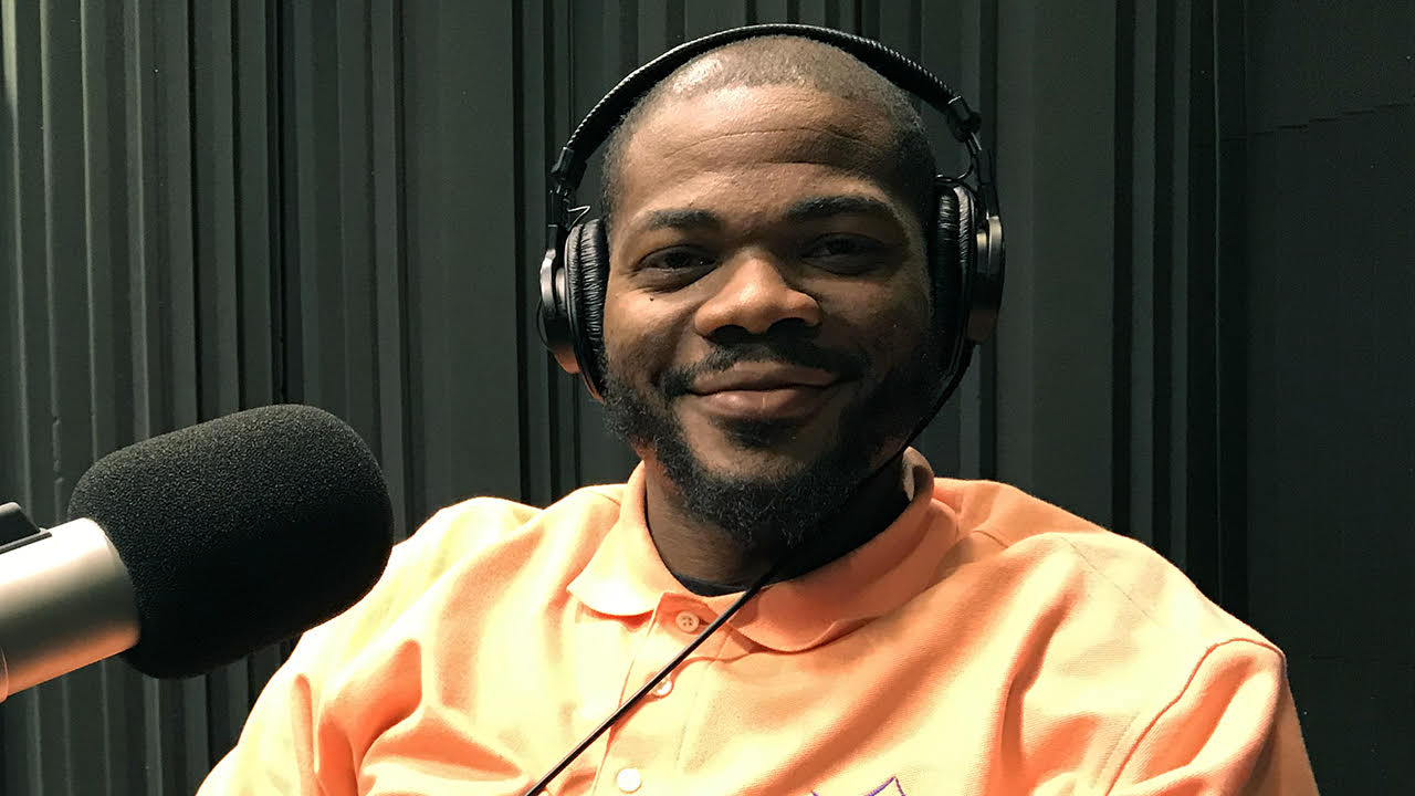 Square headshot of Calvin Hall Jr wearing headphones