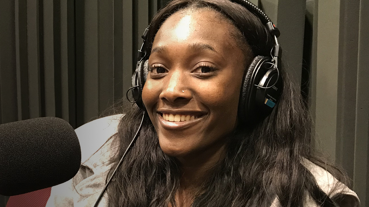 Kadasha Eliacin sitting in WFSU's radio studio in front of the mic